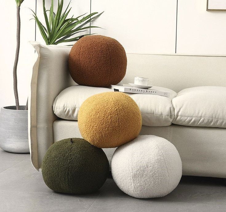 Coussin rond en laine bouclée