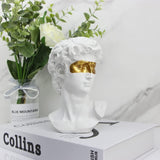 Déco à poser résine David yeux dorés